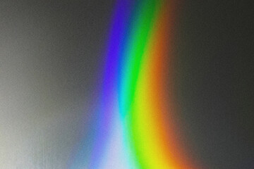 Blurred defocused holographic background. Grain spotted surface. Trendy digital noise.