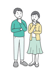 顔に手を当てて悩む成人男女夫婦