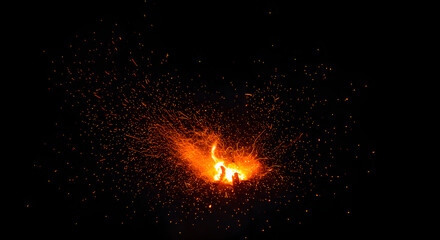 The Eternal Glow of Particles Shines Through Fire Sparks on a Black Canvas Background