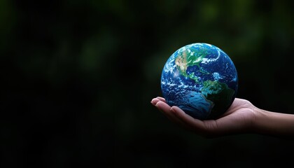 A hand holding a globe, symbolizing care for the planet and environmental awareness.