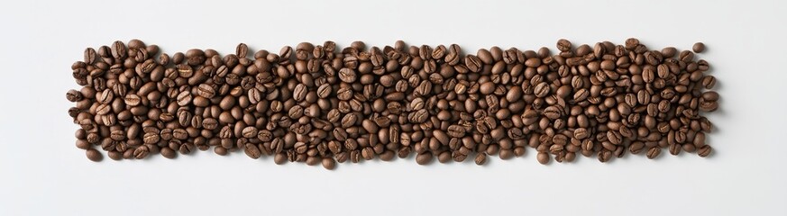 Fototapeta premium Roasted coffee beans arranged in a horizontal line on a white background.