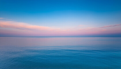 Fototapeta premium Tranquil sea under soft pastel sky. Peaceful and serene ocean landscape. 