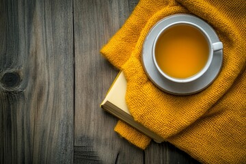 Cozy Tea Scene with Cup, Book, and Yellow Knit Blanket