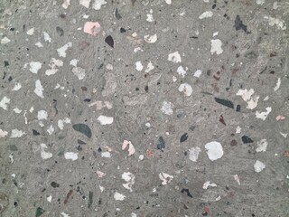 Concrete surface with stones. Polished concrete with small stones
