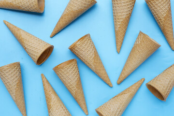 Waffle cones on blue background