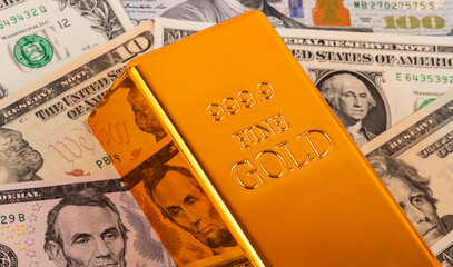 Gold bars and US dollars bills