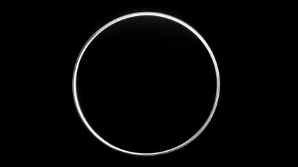 A minimalist white circle on a plain black background, creating a bold and striking visual contrast.