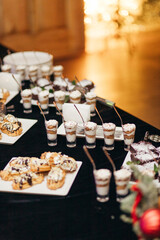 Dessert buffet with trifles and eclairs at a New Year or Christmas party