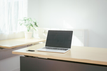 Fototapeta premium A computer is placed on the table, representing a modern workspace for digital tasks, online communication, research, creativity, or professional work in an organized and functional environment