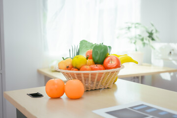 A desk with a fruit basket symbolizes a nutritionist's workspace, promoting healthy eating, balanced diets,wellness through the presentation of fresh fruits organized tools for nutritional planning