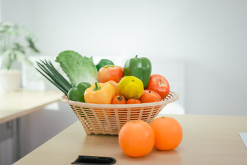 A desk with a fruit basket symbolizes a nutritionist's workspace, promoting healthy eating, balanced diets,wellness through the presentation of fresh fruits organized tools for nutritional planning