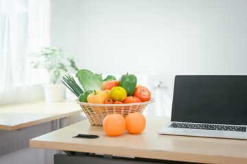 A desk with a fruit basket symbolizes a nutritionist's workspace, promoting healthy eating, balanced diets,wellness through the presentation of fresh fruits organized tools for nutritional planning