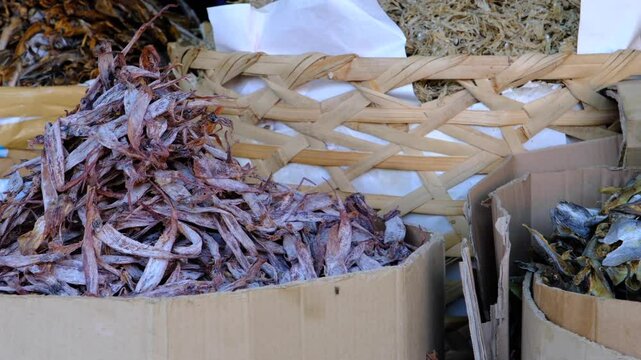 Close-up of dried fish stacks at Carbon Market, Philippines, showcasing local seafood trade, traditional food preservation, and cultural market scenes.