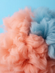 Colorful fluffy pom poms on a light background