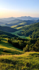 Obraz premium Serene sunrise over rolling green hills and distant mountains; idyllic pastoral landscape, perfect for travel brochures