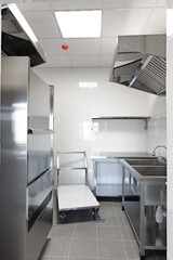 Modern kitchen space featuring stainless steel appliances and professional-grade equipment for culinary activities