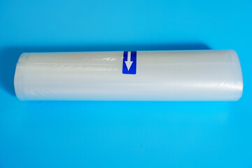Roll film for a product vacuum sealer machine on a blue background. long-term storage of products...