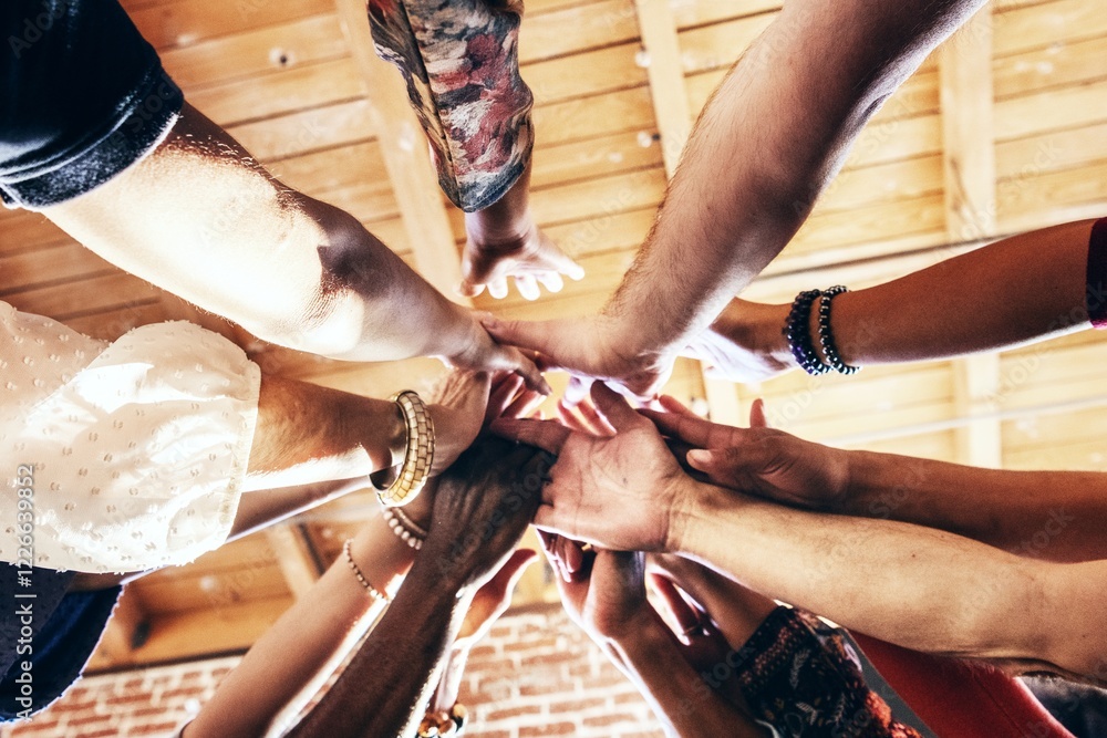 Poster diverse group of hands reaching together in unity. multicultural teamwork, and support. hands of dif