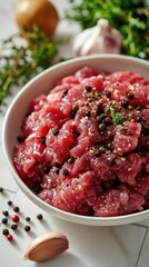 Fresh chopped beef with thyme, salt and pepper preparing for cooking