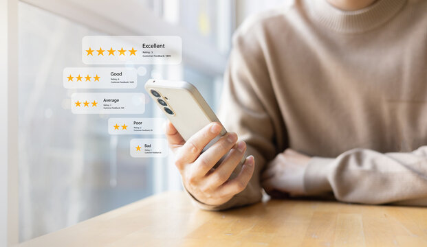 close up young man and hold smartphone and read review online website page about service and experience with many feedback and ranking score from customer for business quality and evaluation concept