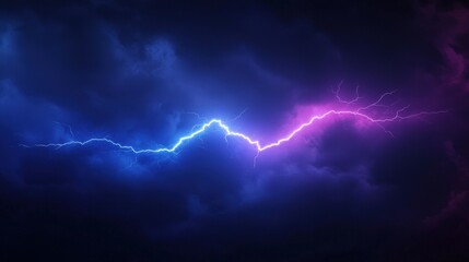 Lightning bolt strikes against a dark sky during a thunderstorm creating a dramatic natural scene