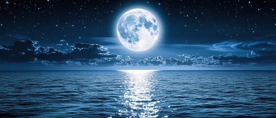 Full moon over dark ocean with starry sky and clouds creating a serene night scene