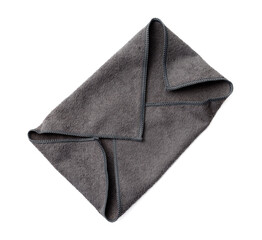 A grey cloth is folded into a triangle