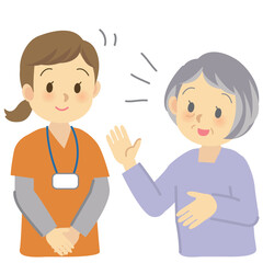 訪問看護の現場＿シニア世代の利用者から相談され傾聴する看護スタッフ（バストアップ）
