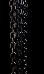 Heavy iron chain. Several hanging chains.