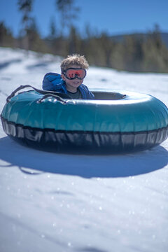 3 YO boy snow tubes solo downhill in Colorado.