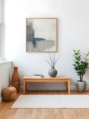 Minimalist modern space with a wooden bench, vases, books, abstract art, potted plant, and natural light