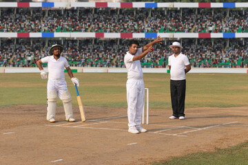 Before the game starts, the bowler positions the fielders, during the cricket game