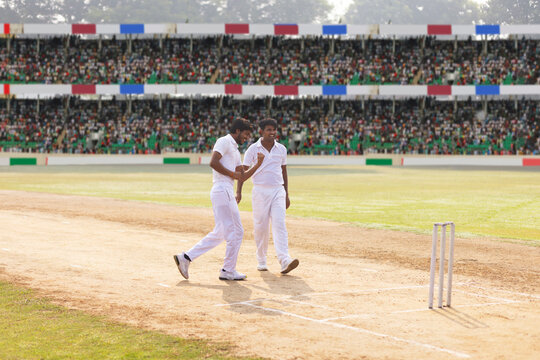 Bowler celebrates with Fielder after he had taken the wicket