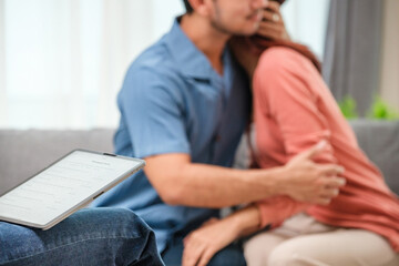 asian couple embraces happily after a productive counseling session with a therapist