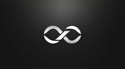 Silver infinity symbol on dark background representing continuity and limitless possibilities in design and art