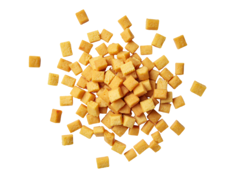 A scattered arrangement of small, golden-brown, cube-shaped snacks is displayed against a clean white background. 