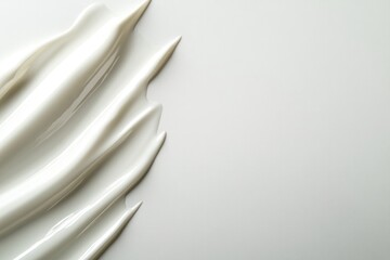Smooth, creamy textures flow elegantly across minimalist backgro