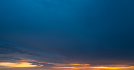 Sunrise background. Dramatic majestic scenery sunset. Sky with clouds in Sunrise sky light background. Sunrise with clouds in various shapes. Calm Sunrise sky and sun through clouds over.