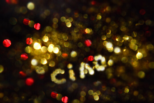 Ciao word on glittering night sky,  Hello in Italian. Celebration, congratulation. bright glow bokeh, fireworks.