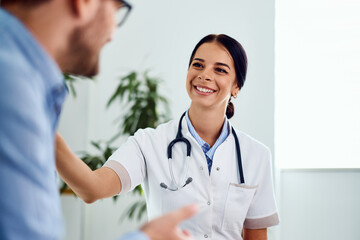 Smiling Nurse Assisting a Patient in a Professional Healthcare Environment