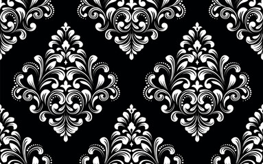 Wallpaper in the style of Baroque. Seamless vector background. White and black floral ornament. Graphic pattern for fabric, wallpaper, packaging. Ornate Damask flower ornament.
