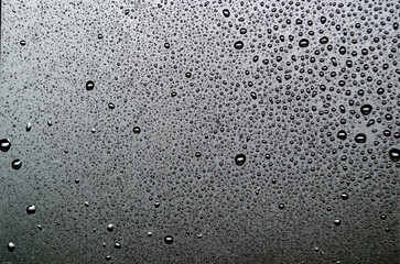 Water droplets with dark background suitable for wallpaper decoration