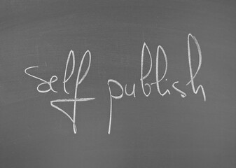 Self publish written in large letters on a chalkboard surface emphasizing creativity and...
