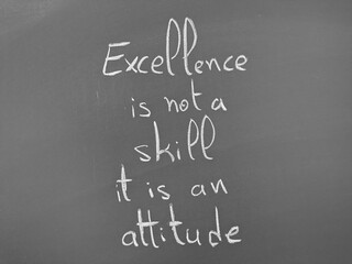 Excellence is not a skill it is an attitude written on a chalkboard in bold handwriting