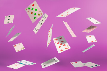flying playing cards on a turquoise background