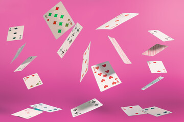 flying playing cards on a turquoise background