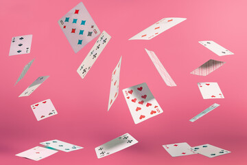 flying playing cards on a turquoise background