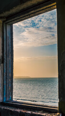sea landscape in the window of the destroyed room