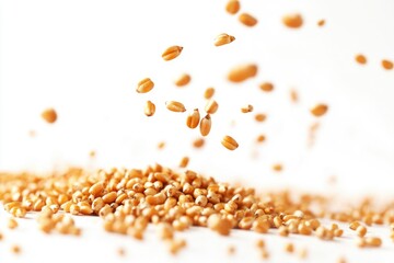 A pile of grains falls off a white surface, perfect for illustrating concepts like loss or abundance