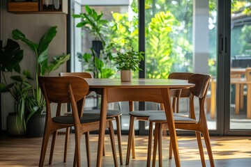 Obraz premium Modern dining room, sunlit, plants, indoor greenery, calm ambiance, home decor, design inspiration